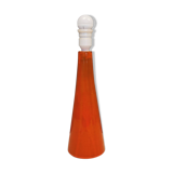 Ceramic table lamp with partial orange glaze.