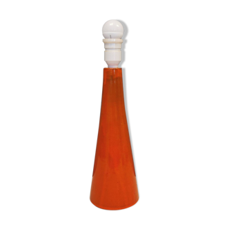 Ceramic table lamp with partial orange glaze.