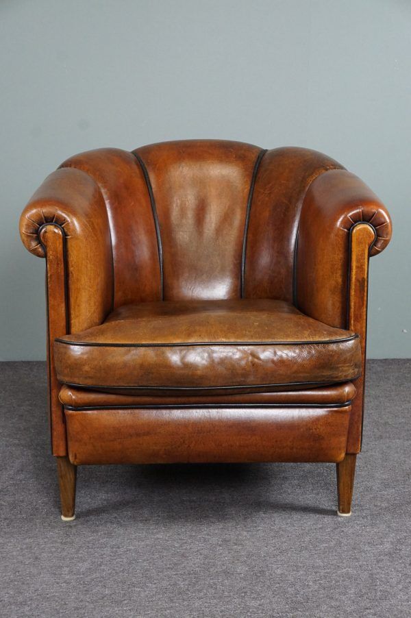 Club armchair in warm coloured sheepskin