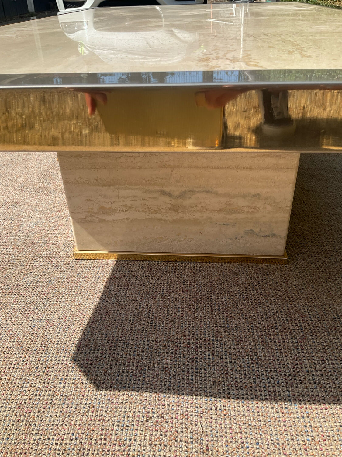 Vintage coffee table in travertine and brass.