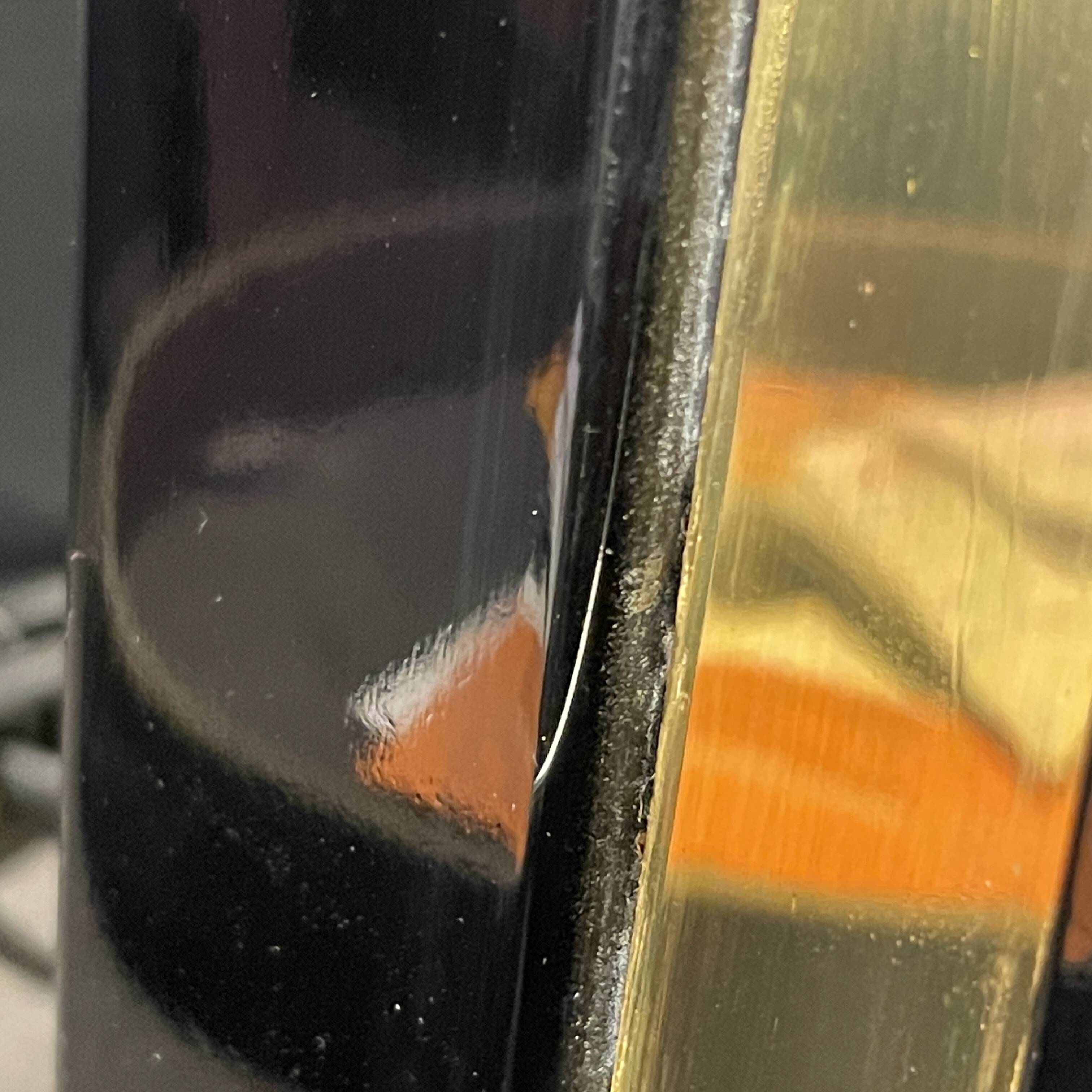 Pair of black lacquered and brass table lamps, circa 1970