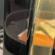 Pair of black lacquered and brass table lamps, circa 1970