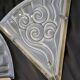 Pair of angular art deco wall sconces with silver metal frames