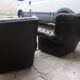 Padded chesterfield leather armchairs
