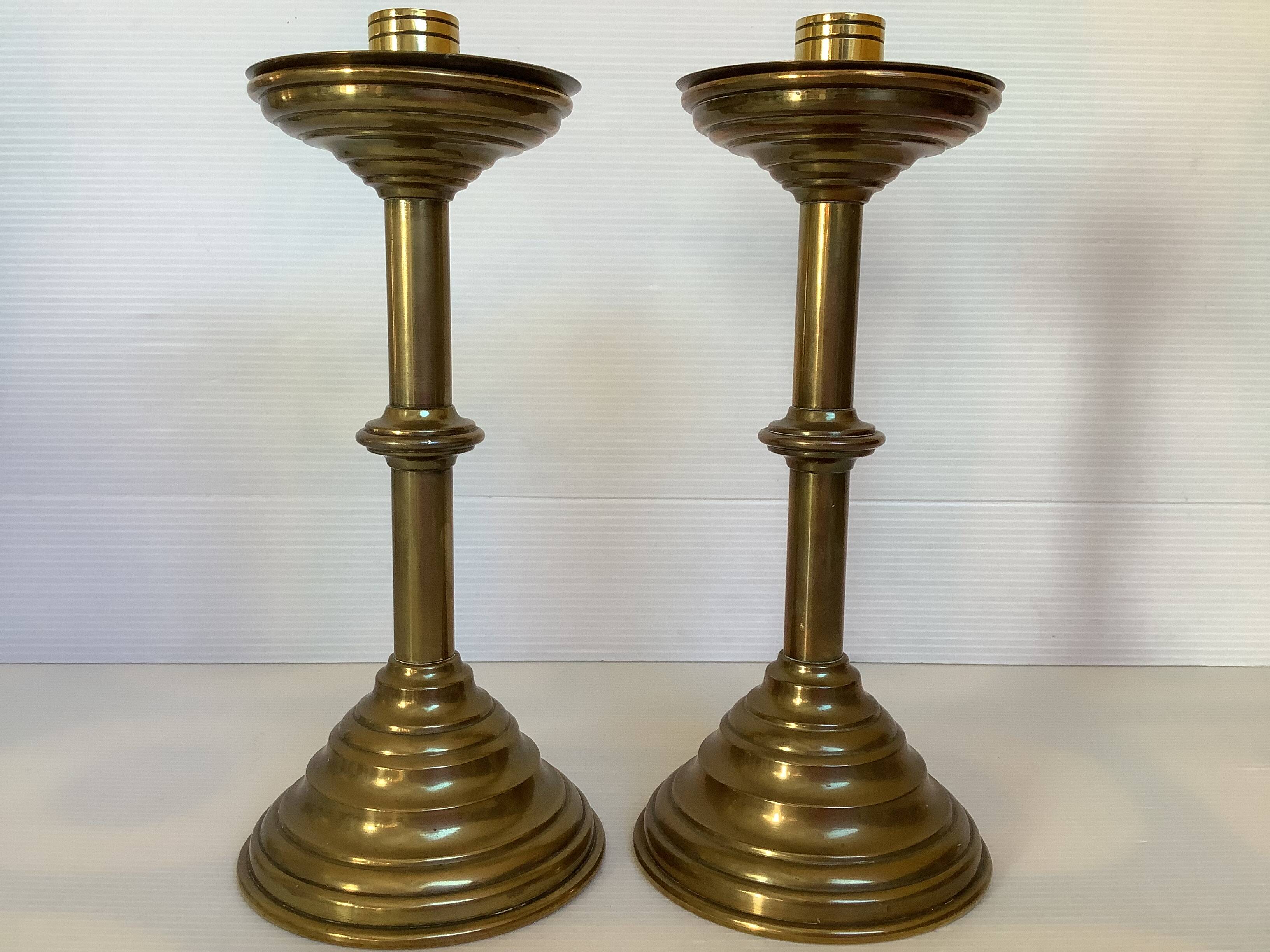 Pair of tulip foot candlesticks in brass
