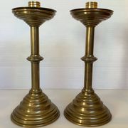 Pair of tulip foot candlesticks in brass