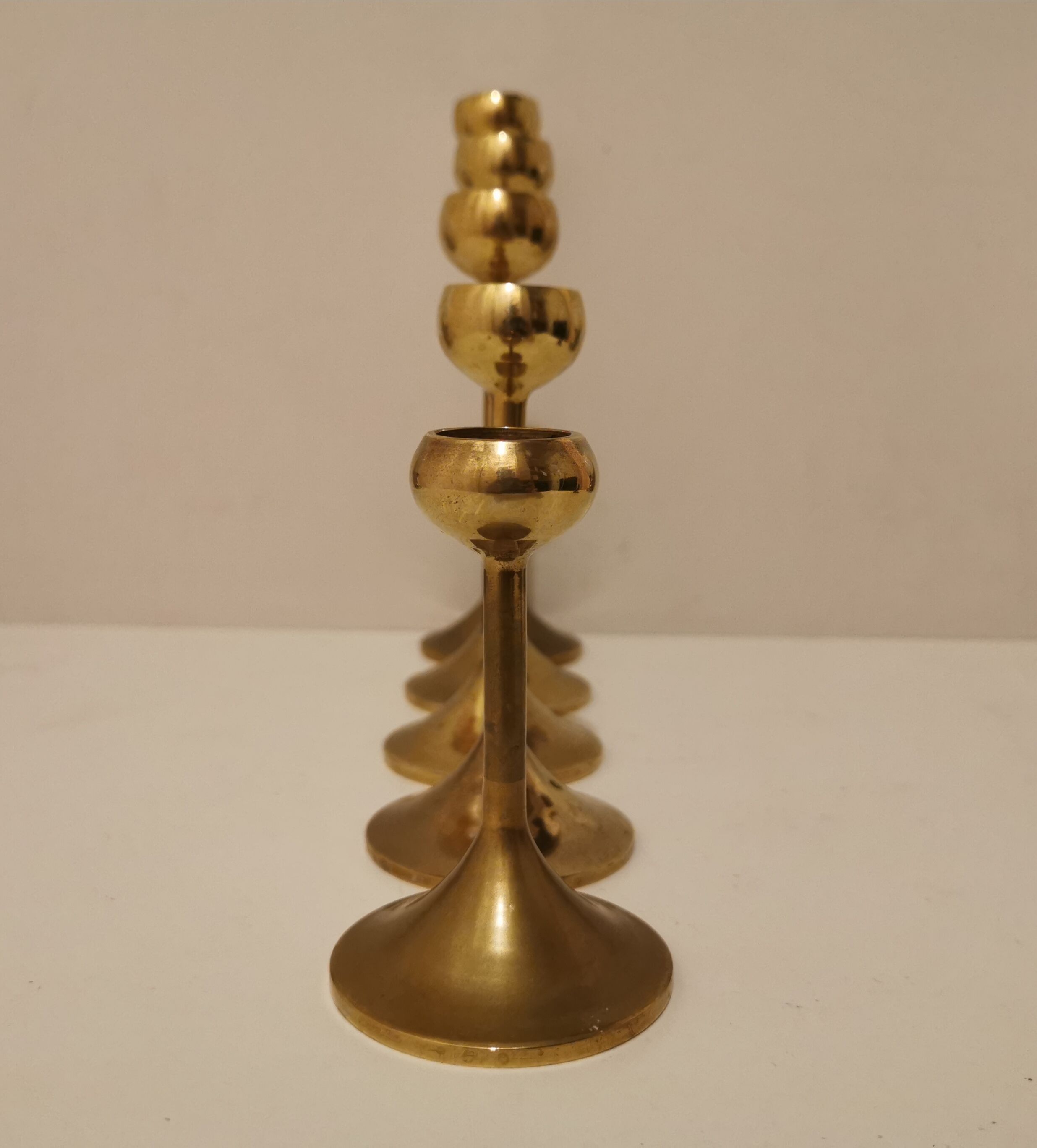 Set of 5 brass candlesticks from the 70s