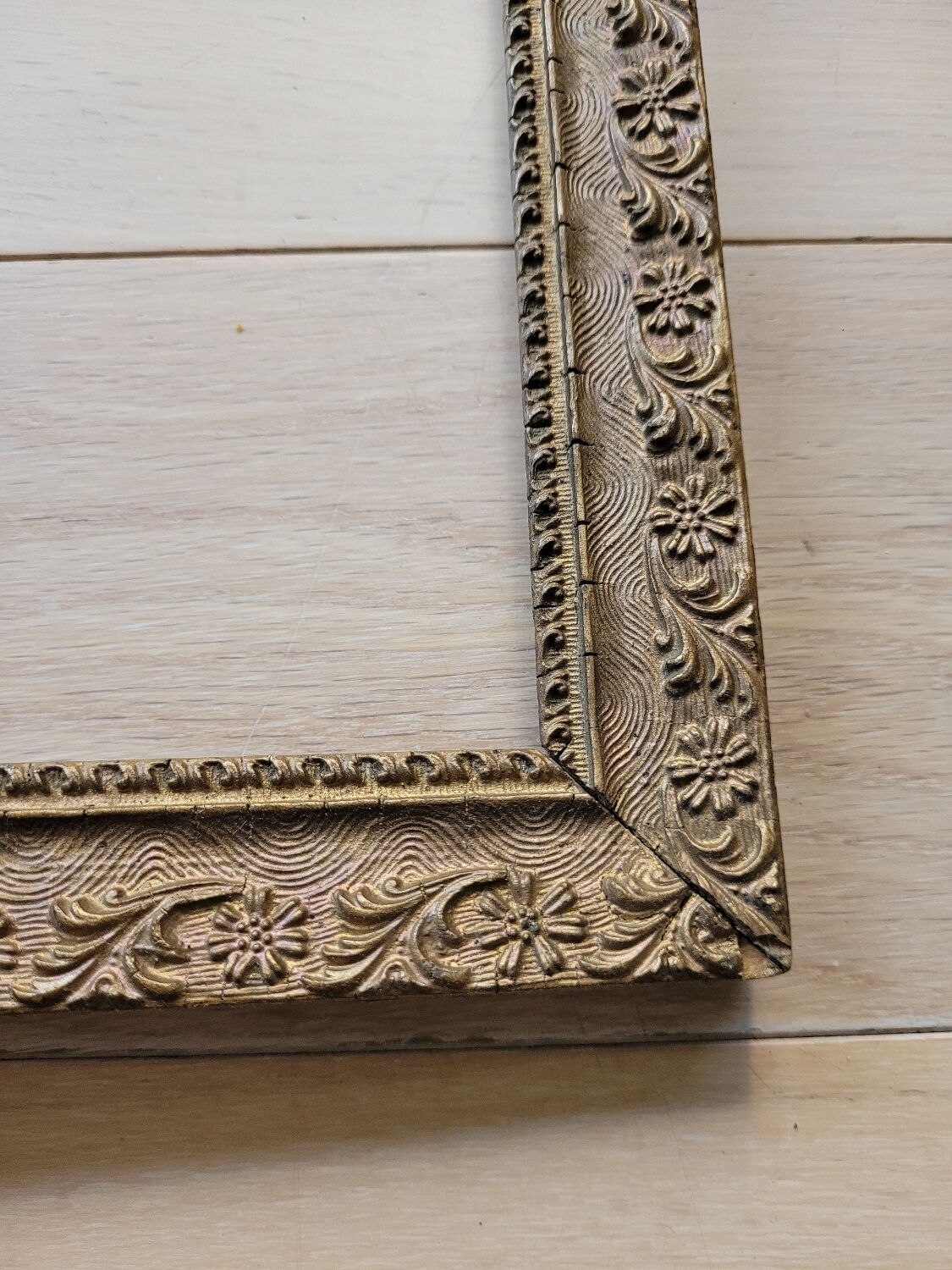 Gilded wooden frame floral moldings