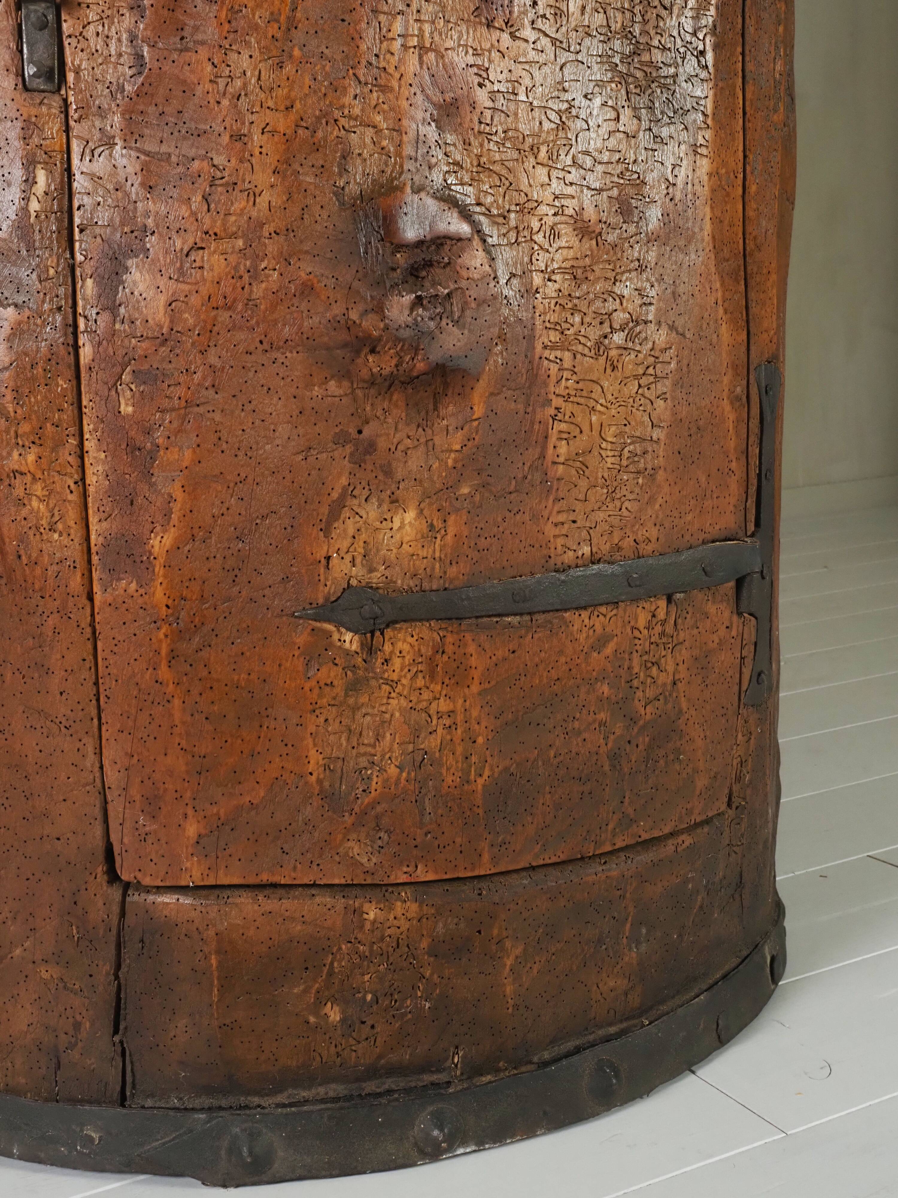 Primitive folk art cabinet made of an old tree trunk.