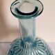 Blue glass carafe with vintage pegs