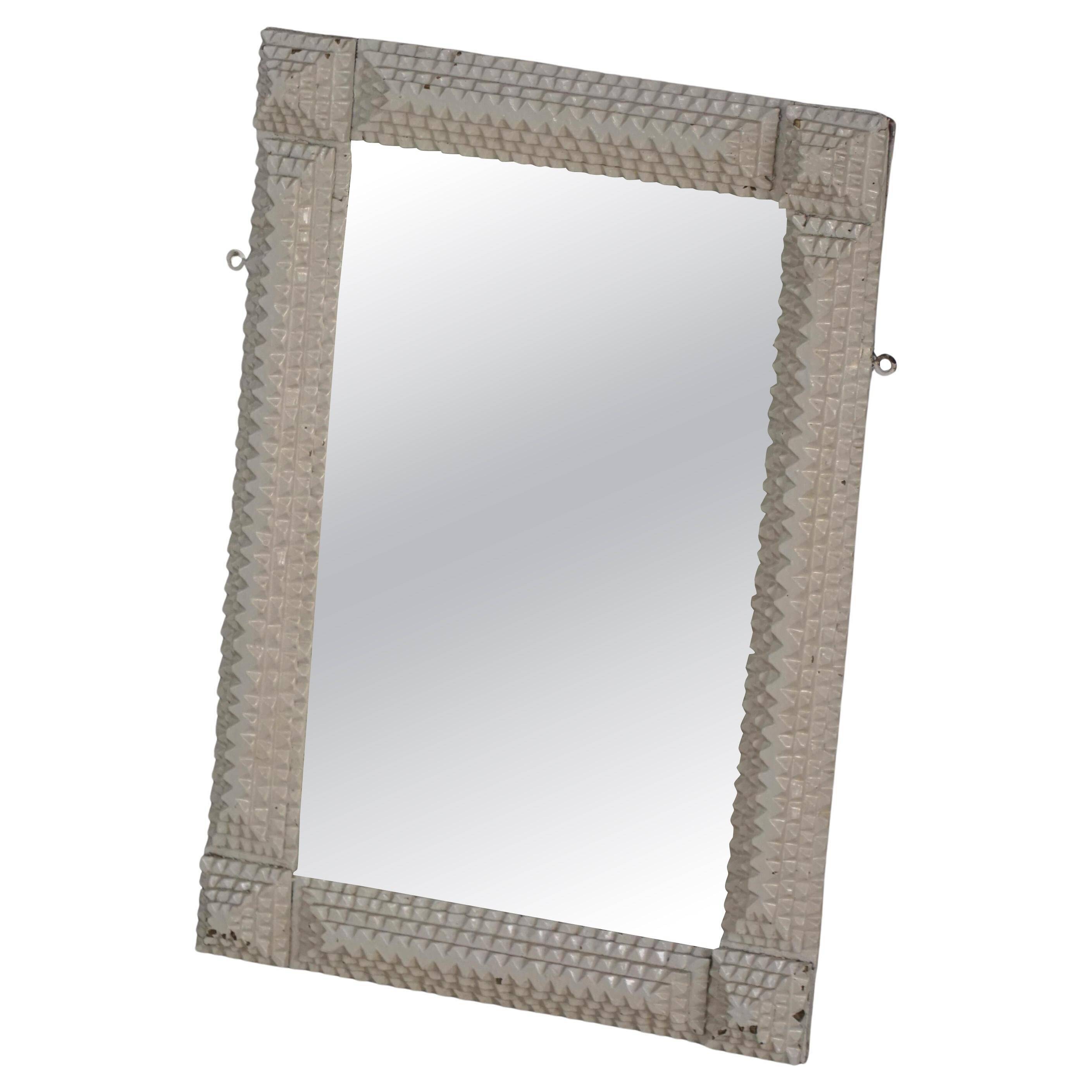 Wall mirror in tramp art style, hand-carved with a painted white frame, early 1900s.