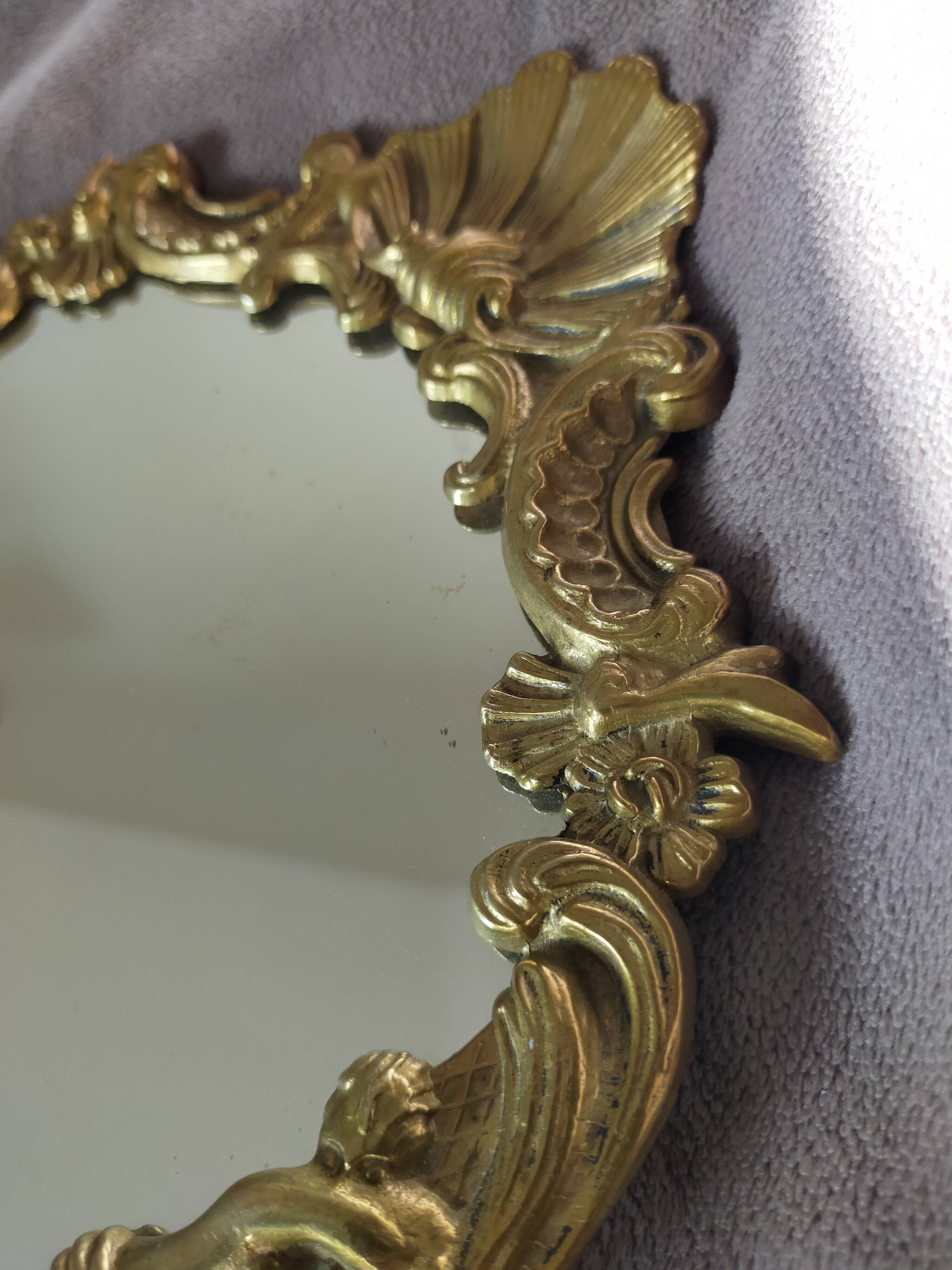 Gilded bronze mirror with angel ornament