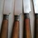 Old table knives and dessert knives, wooden handles, stainless steel blades