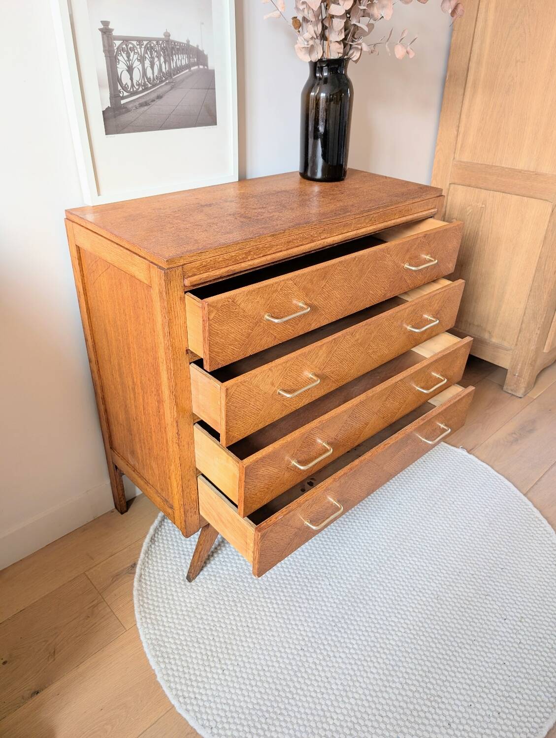 Vintage chest of drawers with checkerboard and compass feet