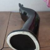 Hand holds black jewelry, ring sizer, soliflore, vintage French, 50s