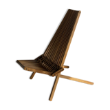Foldable designer armchair in wooden slats
