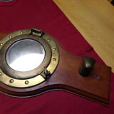 Marine style coat rack with porthole mirror