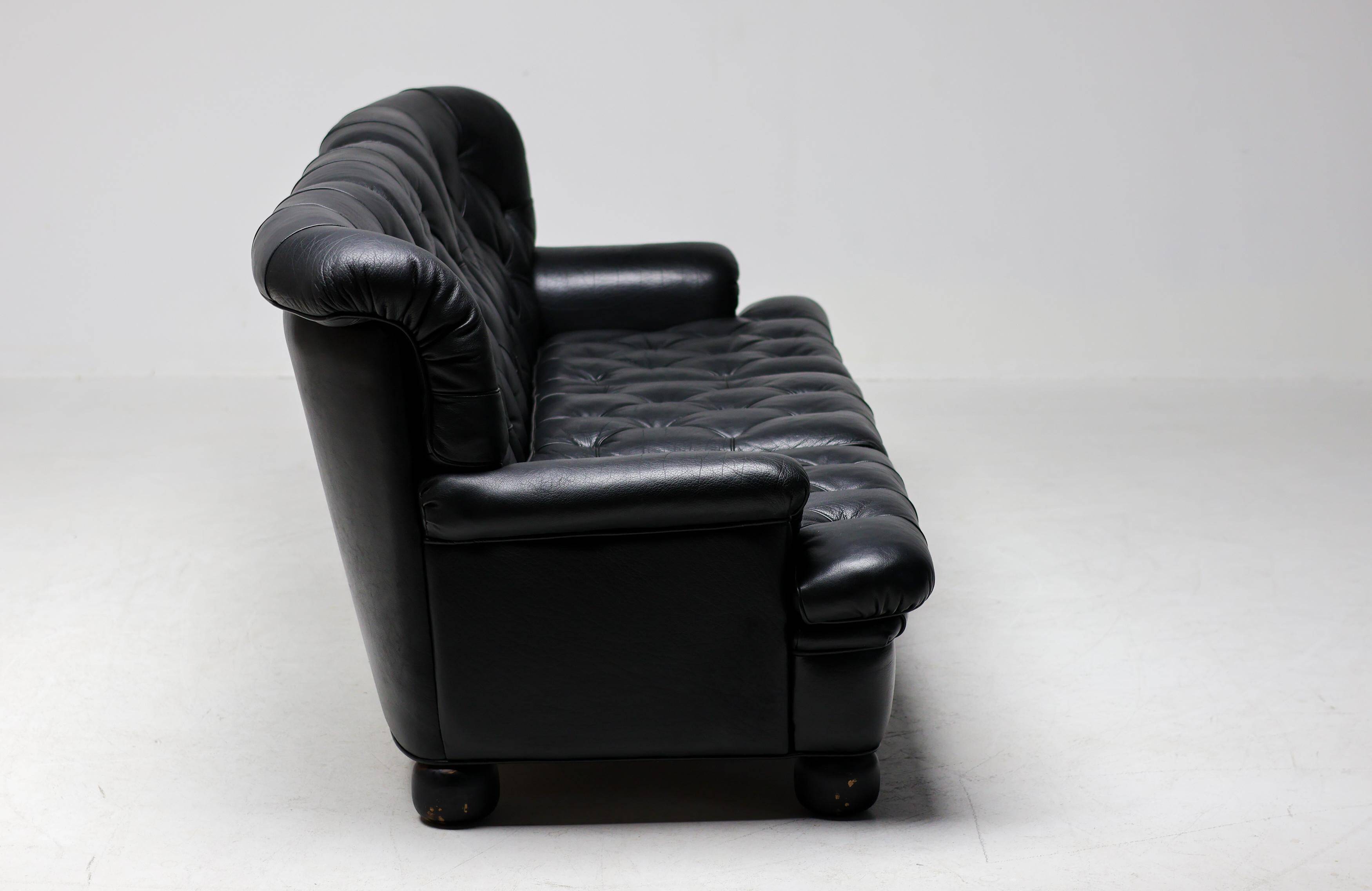 Three-seater sofa "Jupiter" in black leather by Arne Norell, Sweden, 1960.