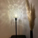 Table lamp with an antique glass lampshade and a gilded foot