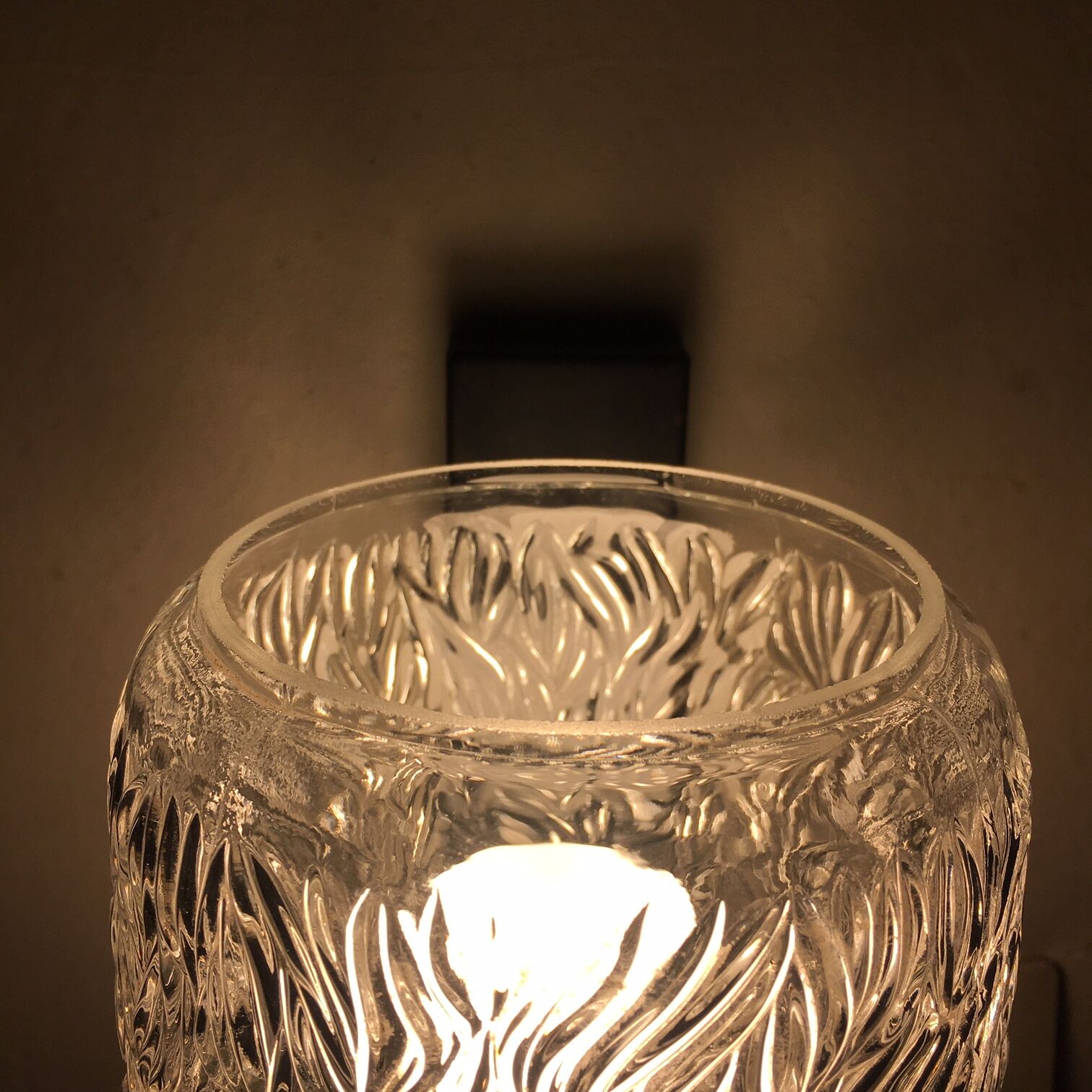 Black metal and molded glass wall sconce