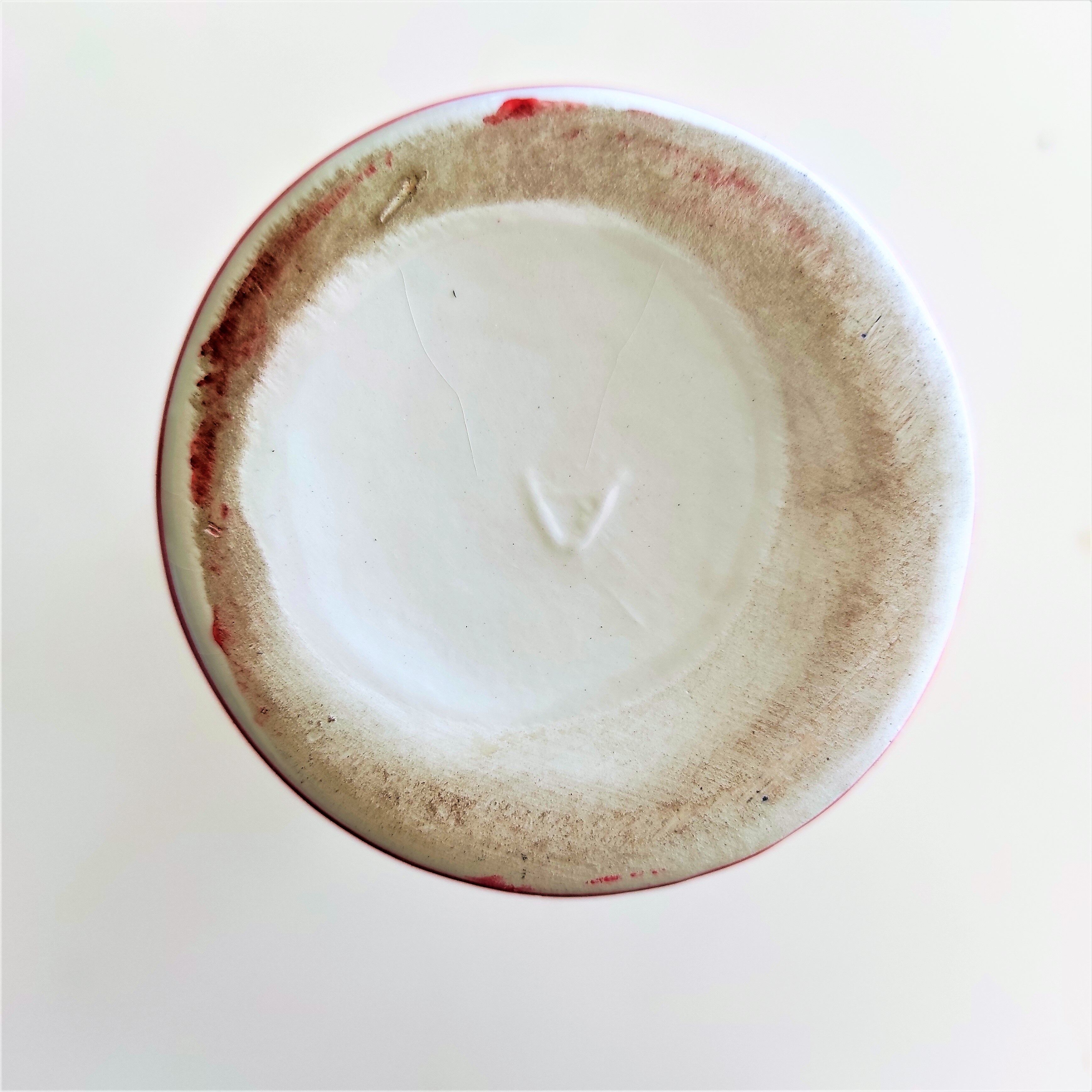 Red and white ceramic vase with vintage embossed mark