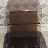 Michel Dumas smoked Plexiglas rolling table.