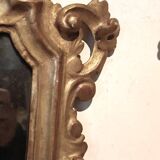 Ancienne paire de miroirs en bois sculpté et doré