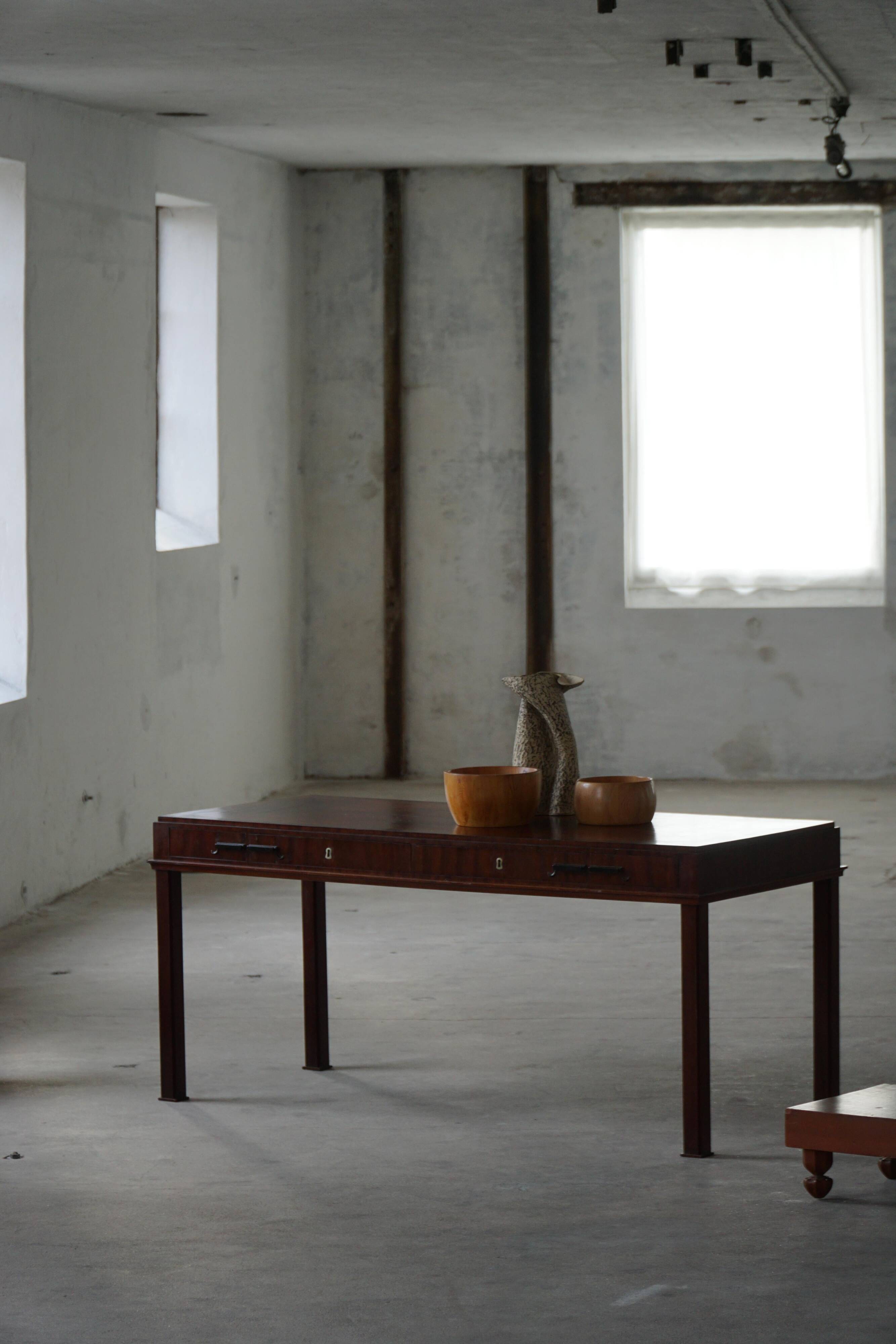 Mid-20th century mahogany writing desk by a Danish cabinetmaker, 1950s.
