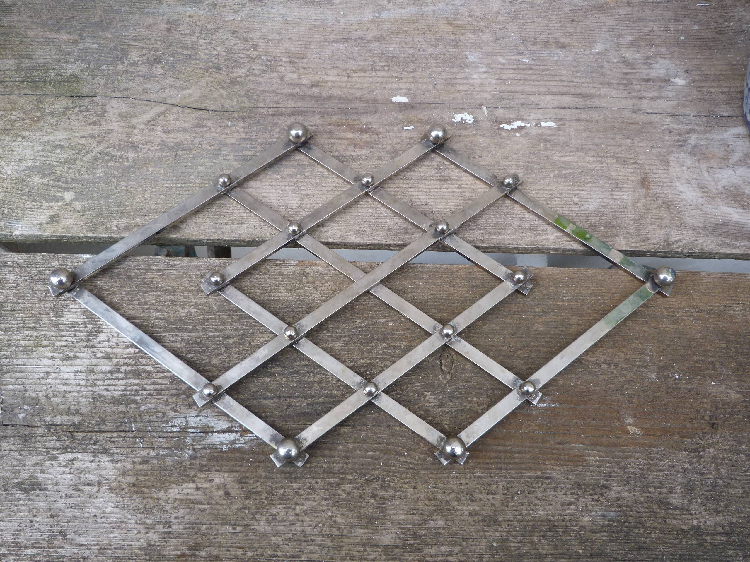 Modernist design foldable trivet in silver metal Jacques Adnet 1940/1950