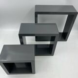 3 nesting shelves in grey lacquer.