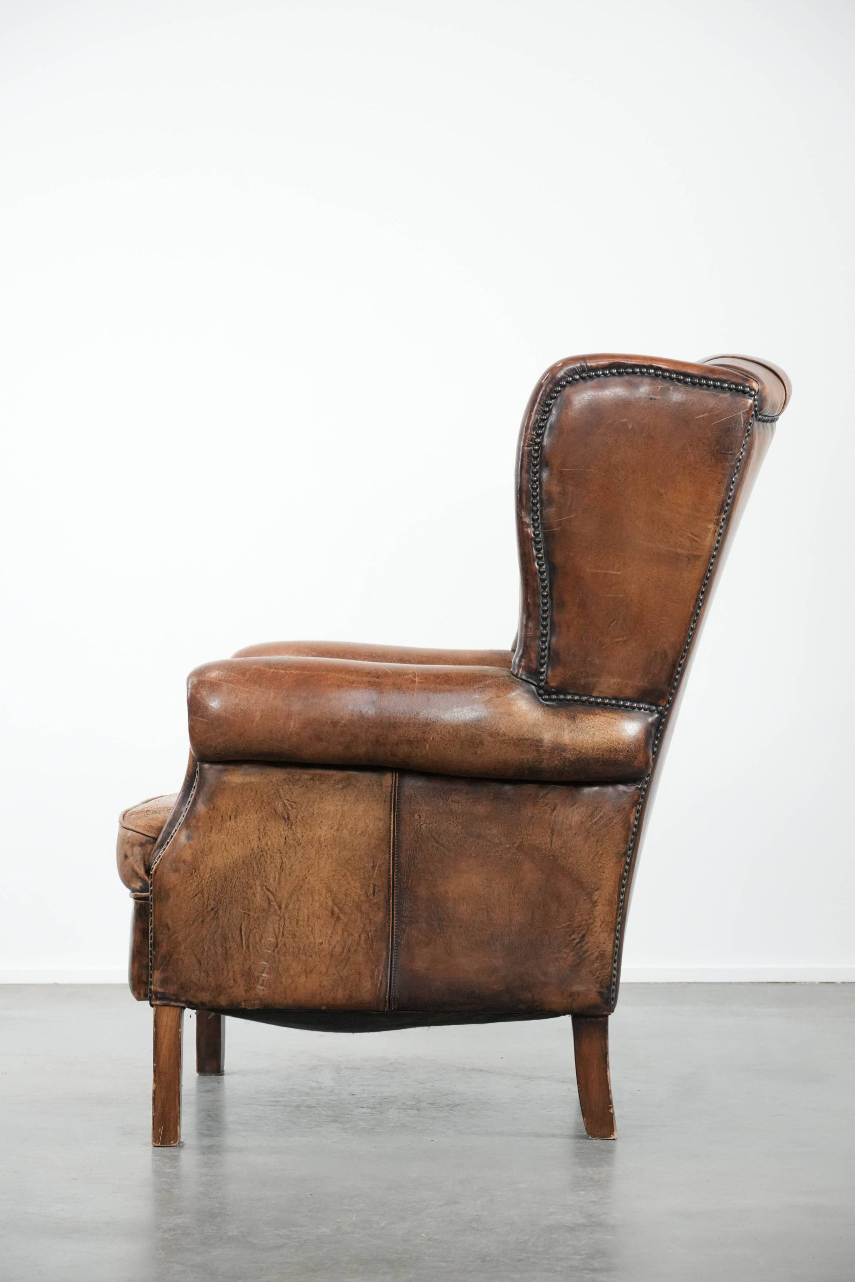 Unique large sheepskin Chesterfield wingback armchair in English style
