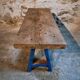Vintage industrial workbench table with cast iron legs (Aux Forges de Vulcain)