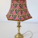 Recycled vintage lamp — antique bronze candlestick base and graphic flowers