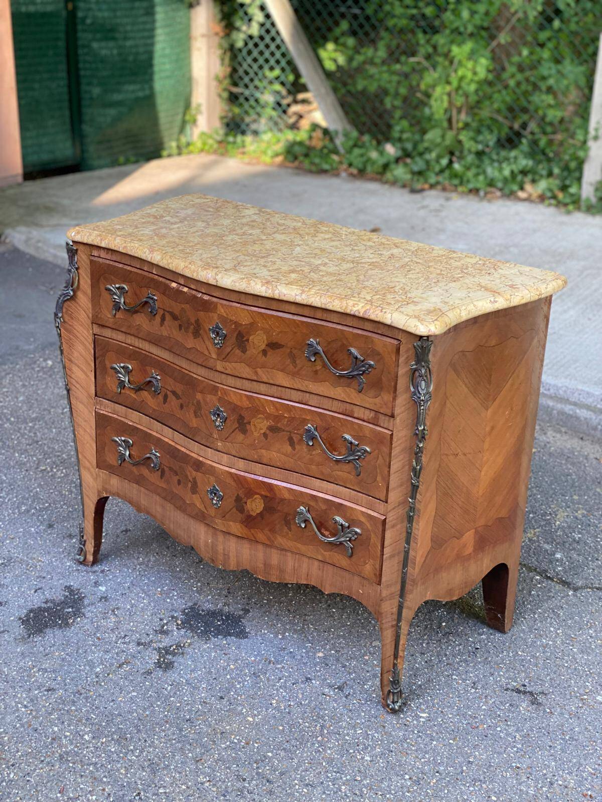 Curved Louis XV chest of drawers in marquetry and beige marble
