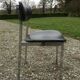6 vintage chairs in black skaï with chrome metal tubular base.