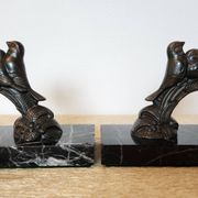 Pair of Art Deco bookends signed Frécourt, patinated metal & black marble