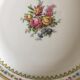 4 mismatched flat plates with floral patterns. Porcelain. Stamped