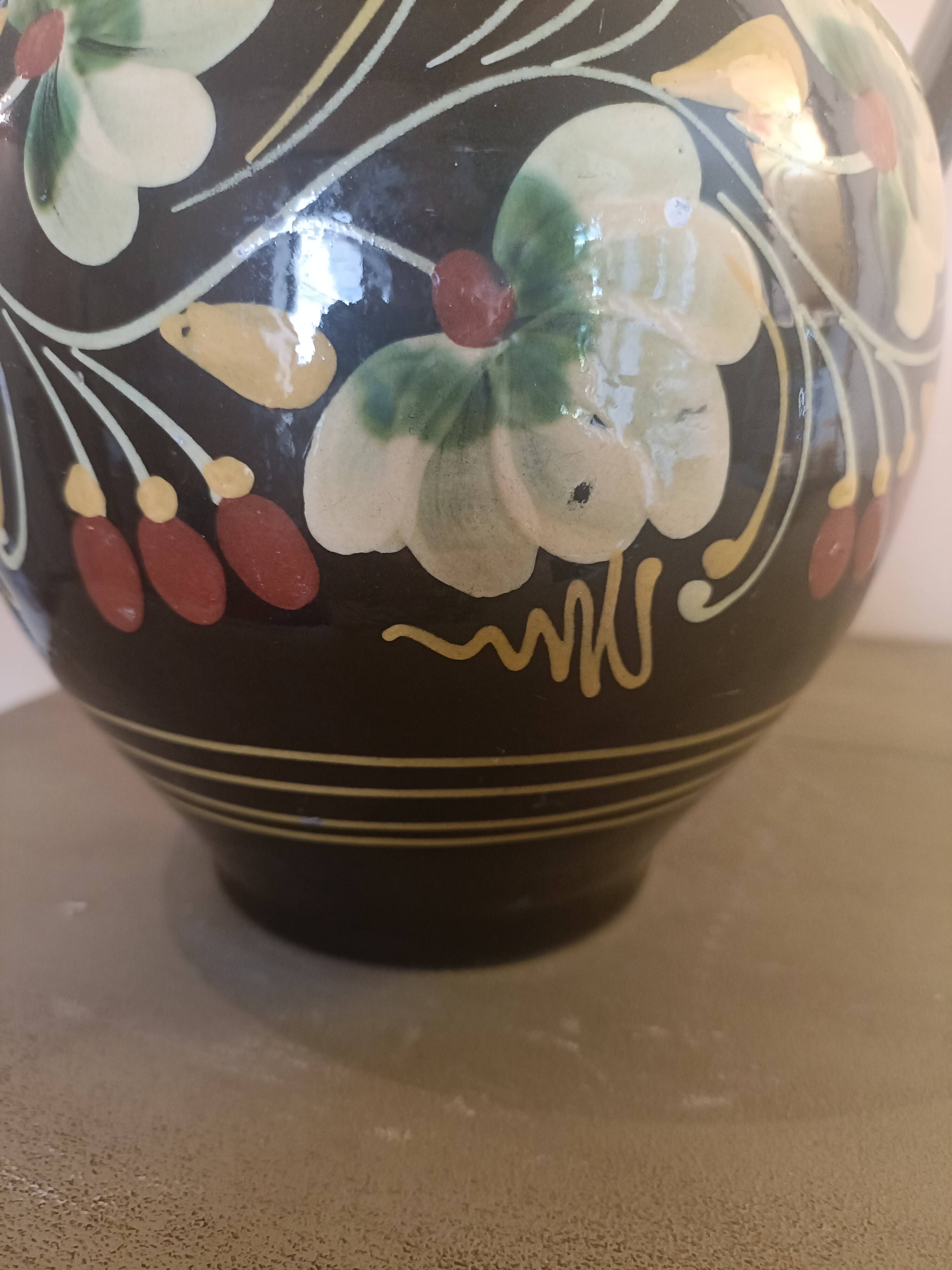 Large glazed terracotta pitcher with floral decoration