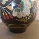 Large glazed terracotta pitcher with floral decoration