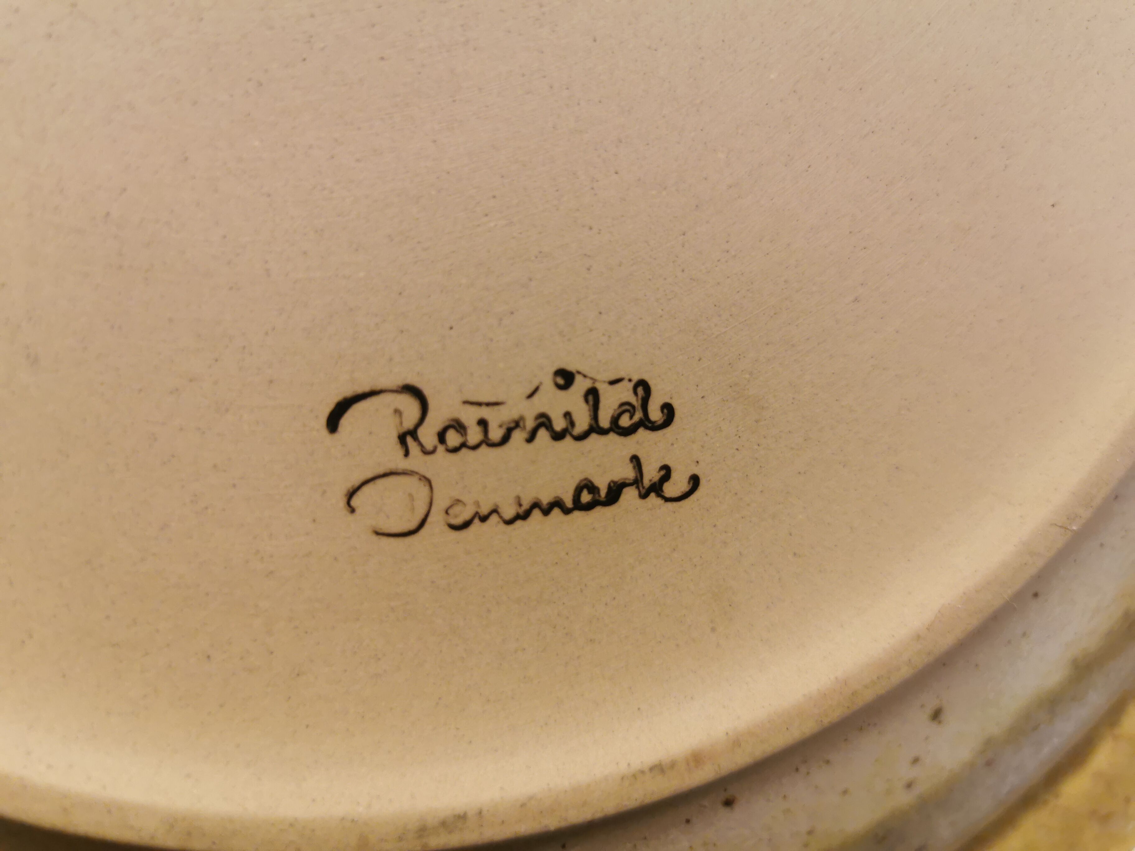 Ceramic plates, designed and made by Danish Ravnild (both stamped and signed)