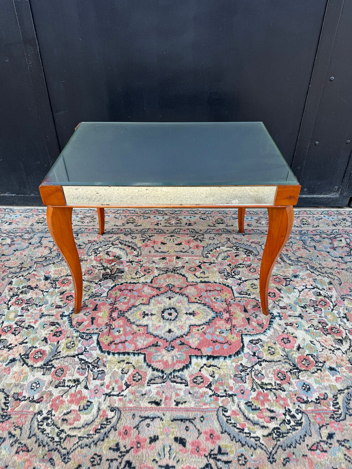 Small wooden coffee table with a mirror from the 1950s.