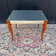 Small wooden coffee table with a mirror from the 1950s.