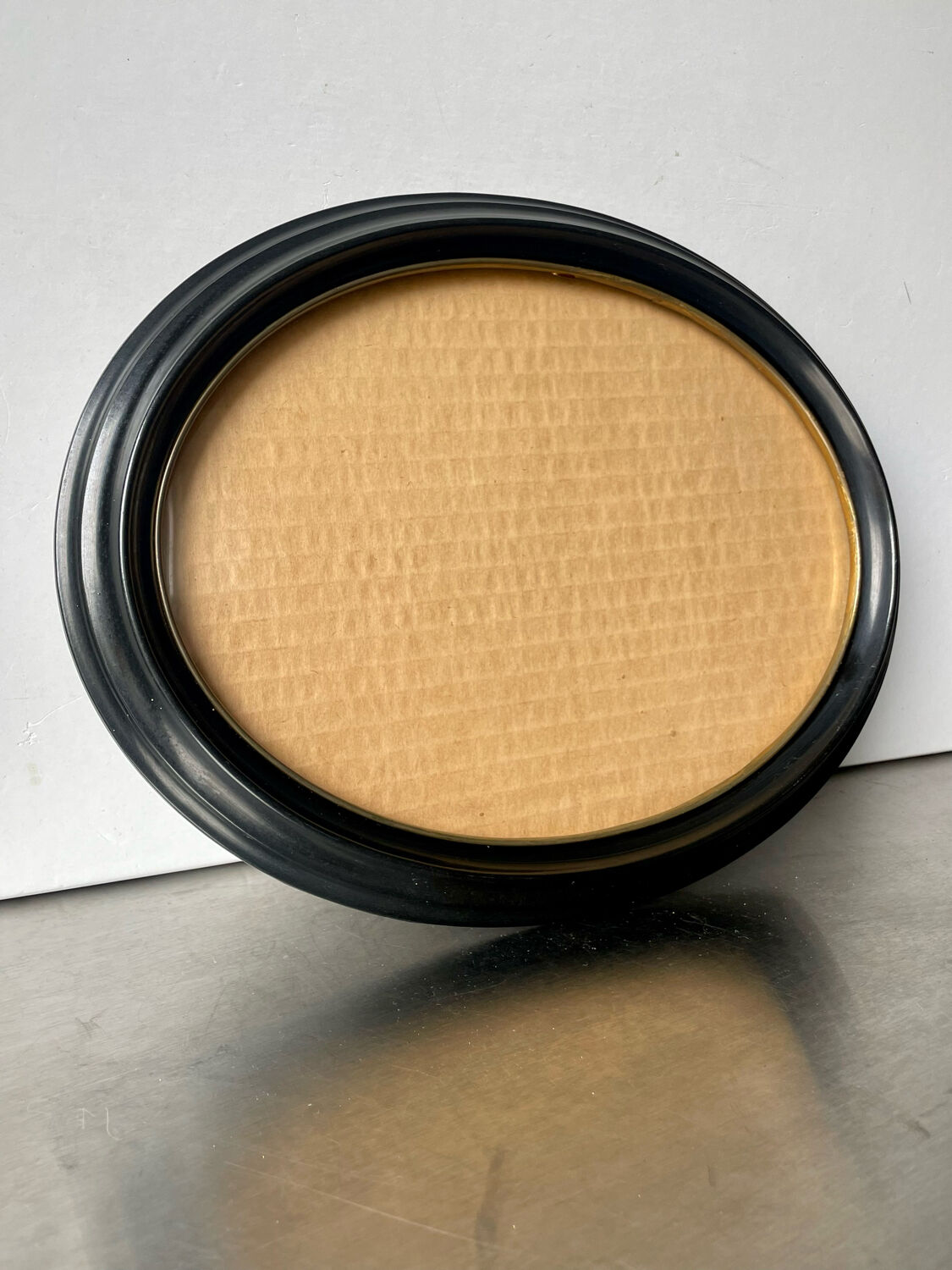 Oval bakelite black vintage frame with convex glass