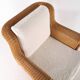 Large wicker armchair and its ottoman