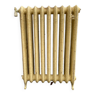 Radiateur ancien sur pieds a neuf lames fleuries en fonte de fer XX siècle