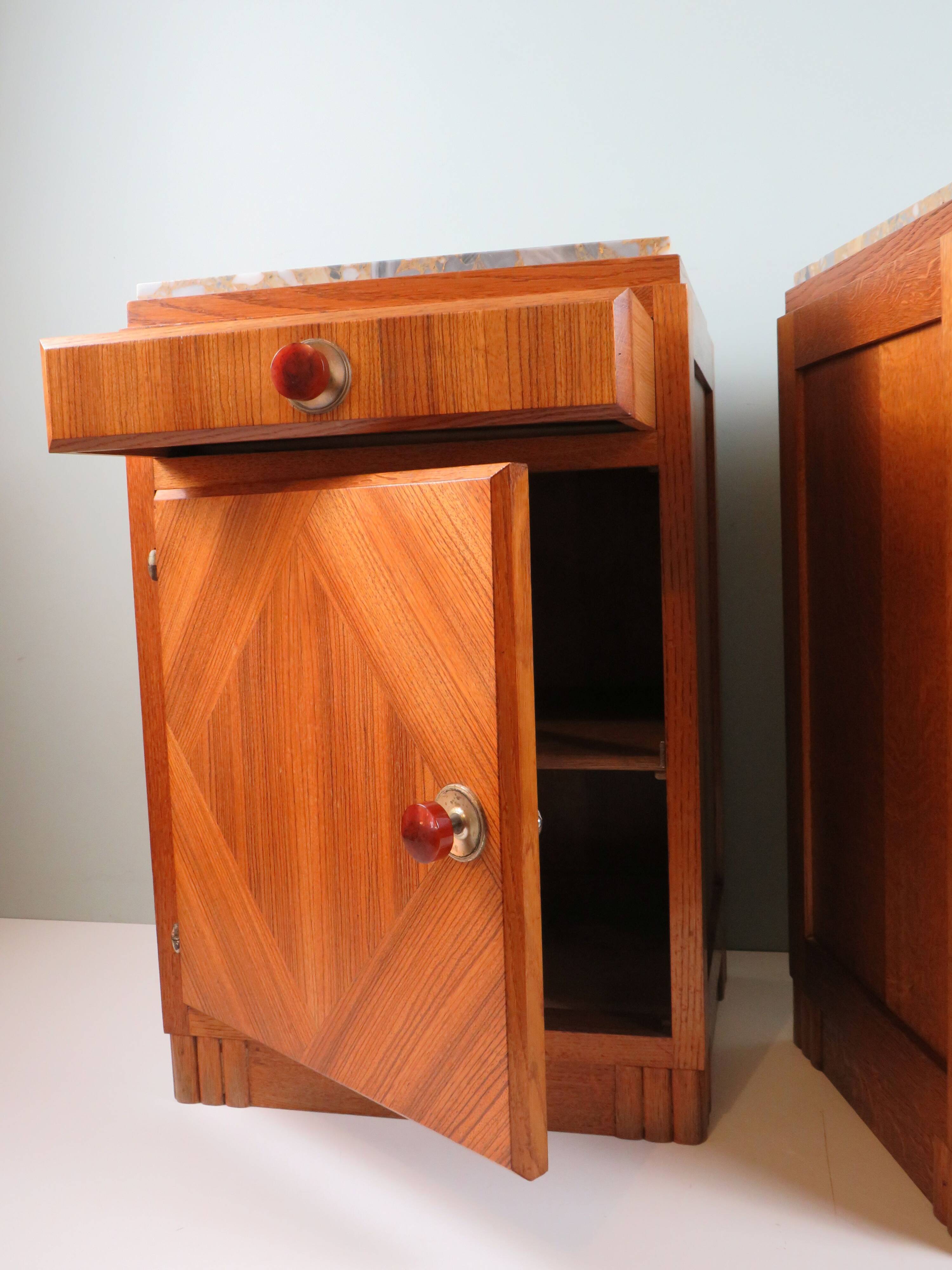 Art Deco bedside tables in oak with an inlaid marble top.