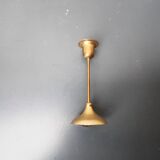 A brass candle holder
