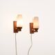 Pair of teak and opaline glass wall lamps, 1950s/1960s