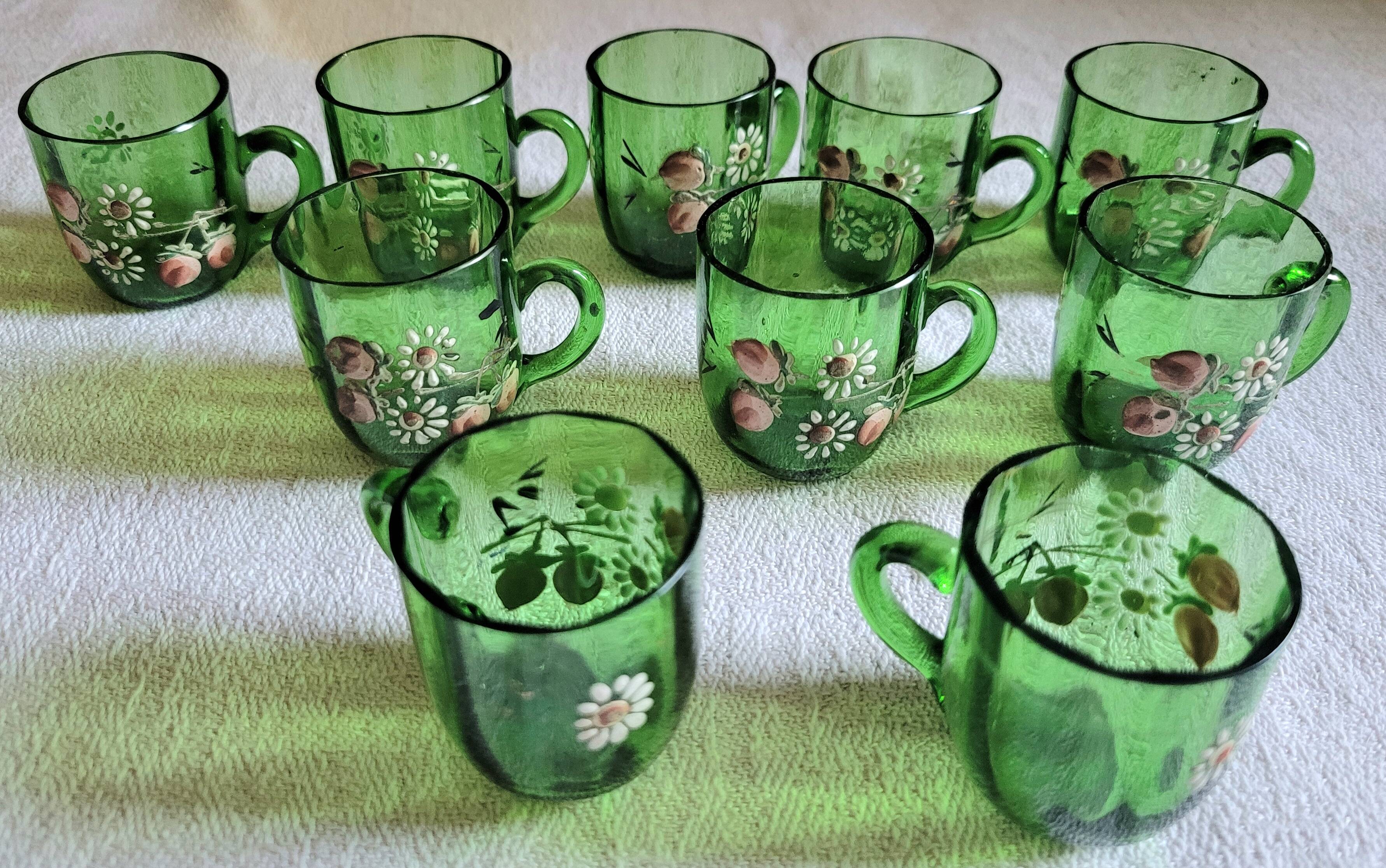 Set of 6 dark green liqueur glasses with handle and floral decoration.