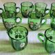 Set of 6 dark green liqueur glasses with handle and floral decoration.